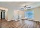Open living room with hardwood floors and ceiling fan at 4660 Edwina Sw Ln, Atlanta, GA 30331