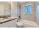 Updated bathroom with granite vanity and marble-tiled shower/tub at 4660 Edwina Sw Ln, Atlanta, GA 30331