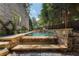 Luxury pool with stonework and multiple water features at 1720 Buckhead Valley Ln, Brookhaven, GA 30324