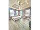 Bright bedroom with a large bed and tray ceiling at 300 Redford Trl, Stockbridge, GA 30281