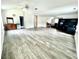 Spacious bonus room with grey wood-look flooring at 300 Redford Trl, Stockbridge, GA 30281