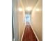 Long hallway with hardwood floors and neutral walls at 300 Redford Trl, Stockbridge, GA 30281