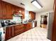 Eat-in kitchen with wood cabinets, granite counters, and stainless steel appliances at 300 Redford Trl, Stockbridge, GA 30281