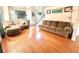 Spacious living room with hardwood floors and large sectional sofa at 300 Redford Trl, Stockbridge, GA 30281