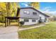 Stylish mid-century home featuring a gray and white exterior and carport at 2045 Pine Oak Dr, Atlanta, GA 30310