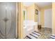 Elegant bathroom with soaking tub, shower, and marble flooring at 2608 Downing Park Se Dr, Conyers, GA 30094