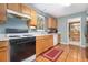 Kitchen with light wood cabinets, tile floor, and view to dining area at 2608 Downing Park Se Dr, Conyers, GA 30094