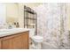Clean bathroom with shower/tub combo, vanity, and linen storage at 2608 Downing Park Se Dr, Conyers, GA 30094