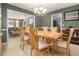 Bright dining room with large table, offering views to the living area at 2608 Downing Park Se Dr, Conyers, GA 30094
