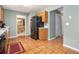 Kitchen with wood cabinets, black appliances, and tile floor at 2608 Downing Park Se Dr, Conyers, GA 30094