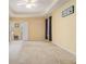 Spacious main bedroom with carpet and ceiling fan at 2608 Downing Park Se Dr, Conyers, GA 30094