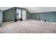 Large bonus room with window, neutral walls and carpet at 2608 Downing Park Se Dr, Conyers, GA 30094