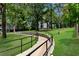 Curved walkway with a railing, leading through a grassy area at 525 Parkway Ne Dr # 220, Atlanta, GA 30308