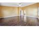 Large bedroom with dark wood floors and an ensuite bathroom at 1243 Royal Ives Ct, Lawrenceville, GA 30045