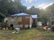 Back of house showing damage and needs significant repair at 879 Edwin Nw Pl, Atlanta, GA 30318