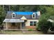 Fixer-upper house with a damaged roof and siding at 879 Edwin Nw Pl, Atlanta, GA 30318