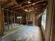 Unfinished living room with exposed beams and fireplace at 879 Edwin Nw Pl, Atlanta, GA 30318