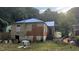 Fixer-upper house with damaged roof and siding at 879 Edwin Nw Pl, Atlanta, GA 30318