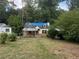 Small house with blue tarp covering roof, needs renovation at 879 Edwin Nw Pl, Atlanta, GA 30318