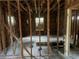 Unfinished bedroom with exposed studs and flooring at 879 Edwin Nw Pl, Atlanta, GA 30318