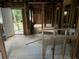 Unfinished interior with exposed studs and flooring at 879 Edwin Nw Pl, Atlanta, GA 30318