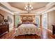 Large main bedroom with hardwood floors and tray ceiling at 2725 Florence Ann Ter, Buford, GA 30519