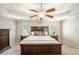 Spacious main bedroom with a king-size bed and ceiling fan at 2725 Florence Ann Ter, Buford, GA 30519