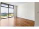 Bedroom with hardwood floors and large windows with a view at 270 17Th Nw St # 2410, Atlanta, GA 30363