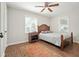 Bright bedroom with hardwood floors and ceiling fan at 725 Washington Ne Ave, Marietta, GA 30060