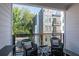 Private balcony with wicker chairs and a small table at 371 Grant Se Cir # 1814, Atlanta, GA 30315