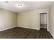 Spacious bedroom with dark brown wood flooring and neutral walls at 2895 Springfield Ct, Atlanta, GA 30349