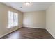 Well-lit bedroom with wood flooring and neutral-colored walls at 2895 Springfield Ct, Atlanta, GA 30349