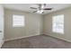Spacious bedroom with ceiling fan and neutral colored walls at 2895 Springfield Ct, Atlanta, GA 30349
