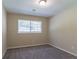Well-lit bedroom with gray carpeting and large window at 2895 Springfield Ct, Atlanta, GA 30349