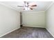 Bright bedroom with ceiling fan and neutral colored carpeting at 2895 Springfield Ct, Atlanta, GA 30349