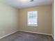 Bright bedroom with gray carpet and a window with blinds at 2895 Springfield Ct, Atlanta, GA 30349