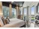 Bright bedroom with king-size bed and access to a private balcony at 400 W Peachtree Nw St # 1204, Atlanta, GA 30308