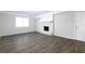 Finished basement with fireplace and wood-look flooring at 541 N Hairston Rd, Stone Mountain, GA 30083