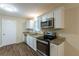 Modern kitchen with granite countertops and stainless steel appliances at 541 N Hairston Rd, Stone Mountain, GA 30083