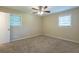 Spacious bedroom with neutral walls and carpet flooring at 541 N Hairston Rd, Stone Mountain, GA 30083