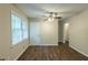 Bright bedroom with hardwood floors and ceiling fan at 541 N Hairston Rd, Stone Mountain, GA 30083