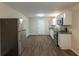 Updated kitchen with stainless steel appliances and hardwood floors at 541 N Hairston Rd, Stone Mountain, GA 30083