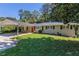 Ranch style home with carport and mature landscaping at 541 N Hairston Rd, Stone Mountain, GA 30083