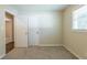 Spacious bedroom with carpet flooring and multiple doors at 541 N Hairston Rd, Stone Mountain, GA 30083