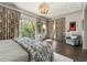 Main bedroom with private balcony access and hardwood floors at 1081 Canton St, Roswell, GA 30075