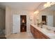 Bathroom with double vanity and access to bedroom at 787 Tidwell Rd, Powder Springs, GA 30127