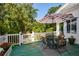 Deck with table and chairs, offering a relaxing outdoor space at 787 Tidwell Rd, Powder Springs, GA 30127