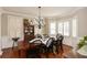 Formal dining room with hardwood floors, large table, and chandelier at 787 Tidwell Rd, Powder Springs, GA 30127