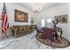 Bright home office with marble floors, chandelier, and antique furniture at 3915 Muirfield Sq, Duluth, GA 30096