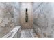 Spa-like shower with multiple shower heads and marble tile at 3915 Muirfield Sq, Duluth, GA 30096